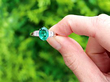 Oval Cut Emerald and Diamond Ring in Platinum outside