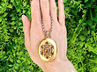 Gemstone Victorian Locket in Gold outside