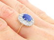 Cushion Cut Sapphire Ring with Diamonds on hand