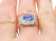 Cushion Cut Sapphire Ring with Diamonds being worn