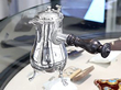 silver coffee pot on desk