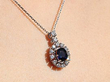 Vintage Sapphire and Diamond Cluster Pendant being worn