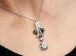wearing Art Deco Diamond Drop Pendant in Platinum