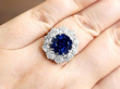 wearing Sapphire and Diamond Cluster Ring in Yellow Gold