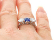 Sapphire Trilogy Engagement Ring in Platinum on finger