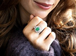 model wearing an emerald cluster ring