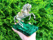 Silver Horse Sculpture on Malachite Base outside