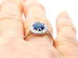 Oval Blue Sapphire Engagement Ring on Finger