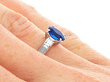 Oval Sapphire Ring with Diamond Shoulders being worn