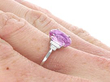 Pink Sapphire Engagement Ring with Baguette Diamonds on hand