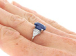 Oval Sapphire Engagement Ring in Platinum on hand