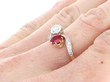 cushion cut ruby twsit ring on finger