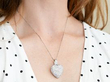 wearing Diamond Heart Pendant Necklace in White Gold