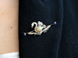 Victorian Gemstone Swan Brooch in Gold being worn