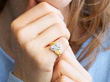wearing Twist Pear Cut Cluster Engagement Ring in Gold