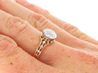 Bezel Set Round Engagement Ring in Gold on hand