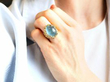 wearing Naturalistic Cabochon Aquamarine Ring in Yellow Gold