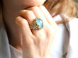 Naturalistic Cabochon Aquamarine Ring in Yellow Gold wearing