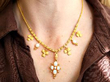 Wearing Gold and Opal Necklace