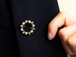 gemstone wreath brooch on blazer