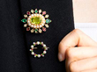 wearing gemstone brooches