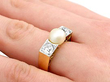 pearl diamond ring being worn