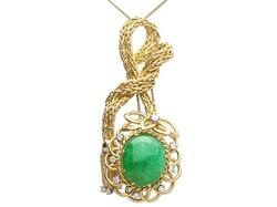 Cabochon Emerald Brooch in Gold