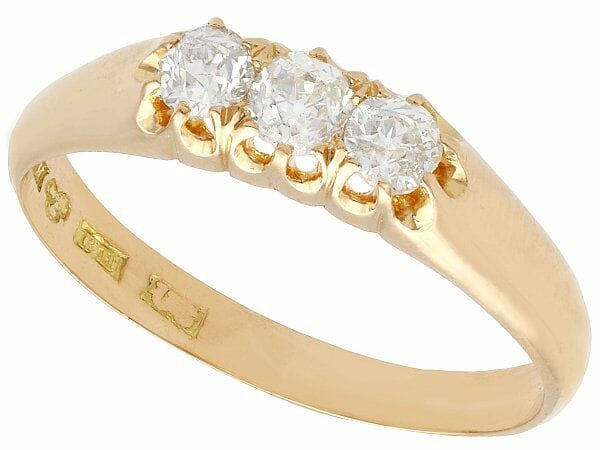 diamond and yellow gold antique trilogy ring