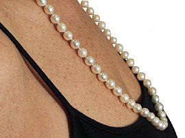 pearl necklace on the neck