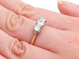 vintage diamond trilogy ring on finger
