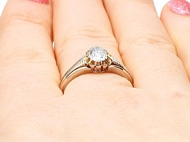 Victorian solitaire ring on finger