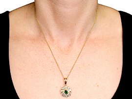 wearing emerald pendant