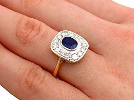 vintage sapphire cluster ring on the finger
