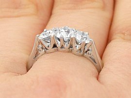 platinum three stone diamond ring on finger