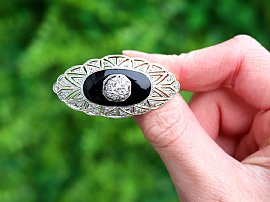 Onyx brooch with diamonds outside