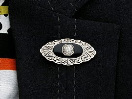 Onyx brooch with diamonds wearing