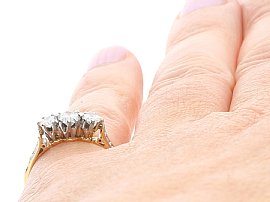 Wearing Round Brilliant Cut Diamond Trilogy Ring