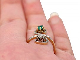 Antique Emerald and Diamond Ring in Gold Wearing Finger