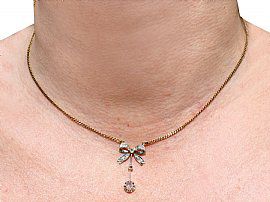 Antique Diamond Bow Necklace being worn