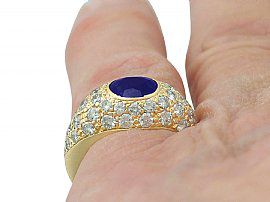 Oval Cut Sapphire and Diamond Ring Wearing Finger