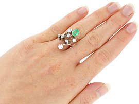 wearing emerald and diamond ring