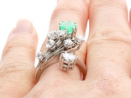 Emerald and Diamond Ring on Finger