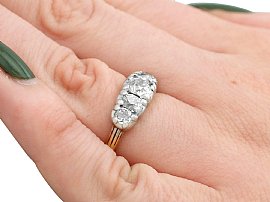 five stone diamond ring in yellow gold on the hand