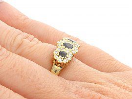 Sapphire and Diamond Yellow Gold Ring Wearing Hand