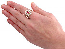 wearing ruby and diamond cluster ring