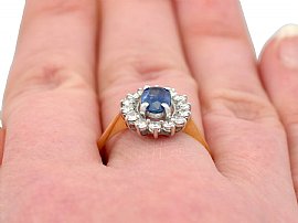 wearing sapphire and diamond cluster ring