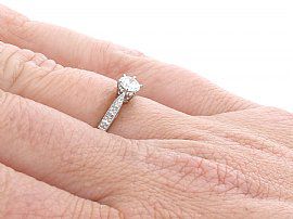 wearing diamond solitaire ring in platinum