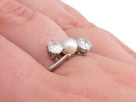 pearl and diamond ring on finger