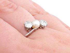 pearl and diamond ring on finger
