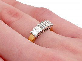 five stone diamond ring on finger